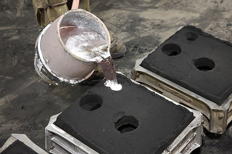 pour the molten metal into the mold cavity